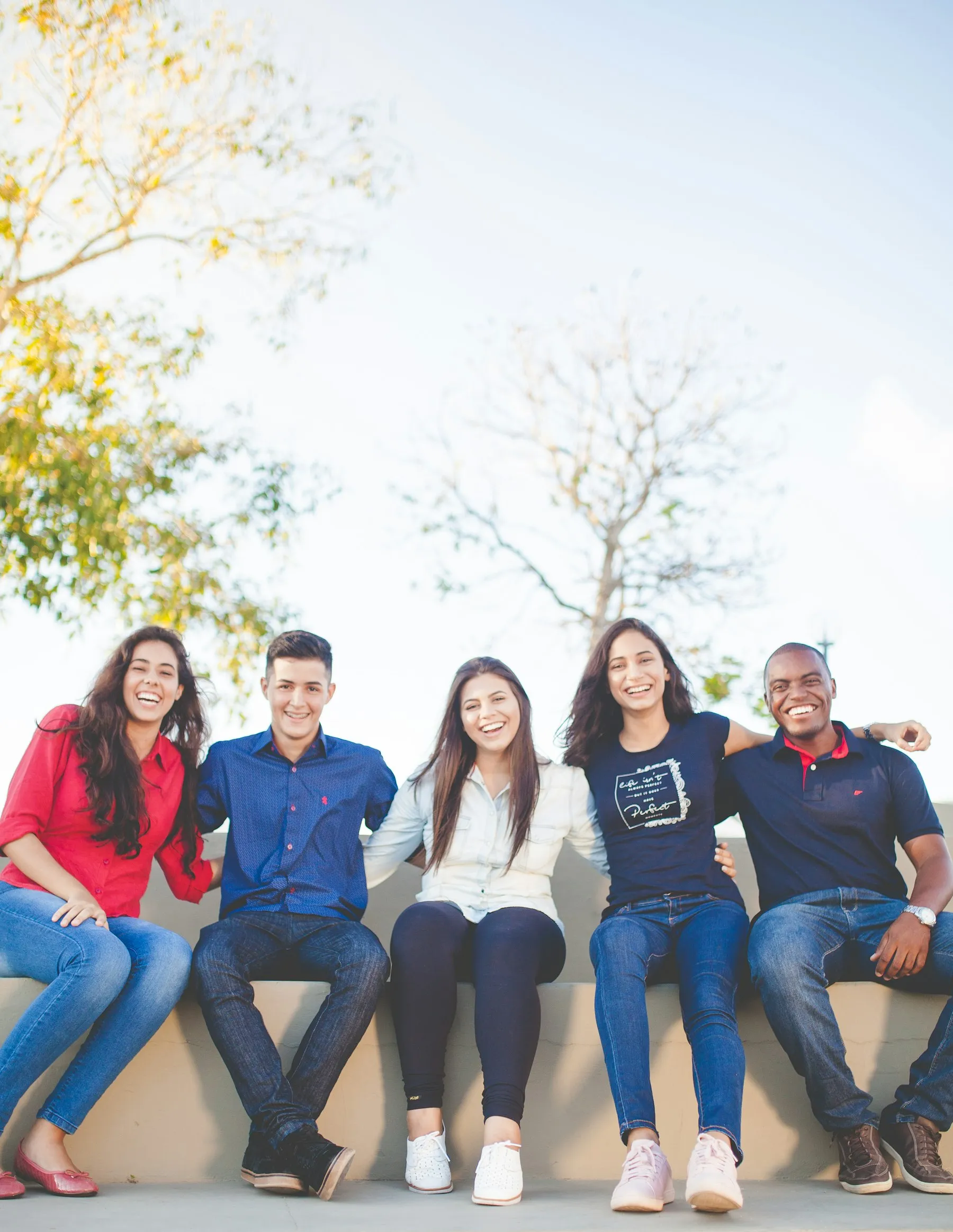 A group of students smiling together outdoors